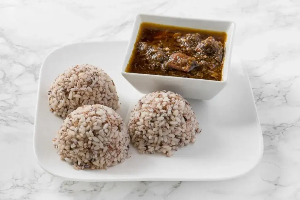 Assorted Pepper Soup with parboiled rice at Akin's African Restaurant Winnipeg